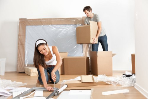 Furniture collection team handling bulky items in a Canary Wharf apartment building