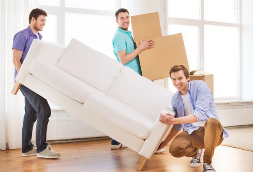 Professional team handling office furniture and equipment move