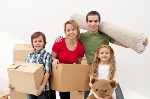 Loading furniture into a moving truck near Canary Wharf apartments and offices